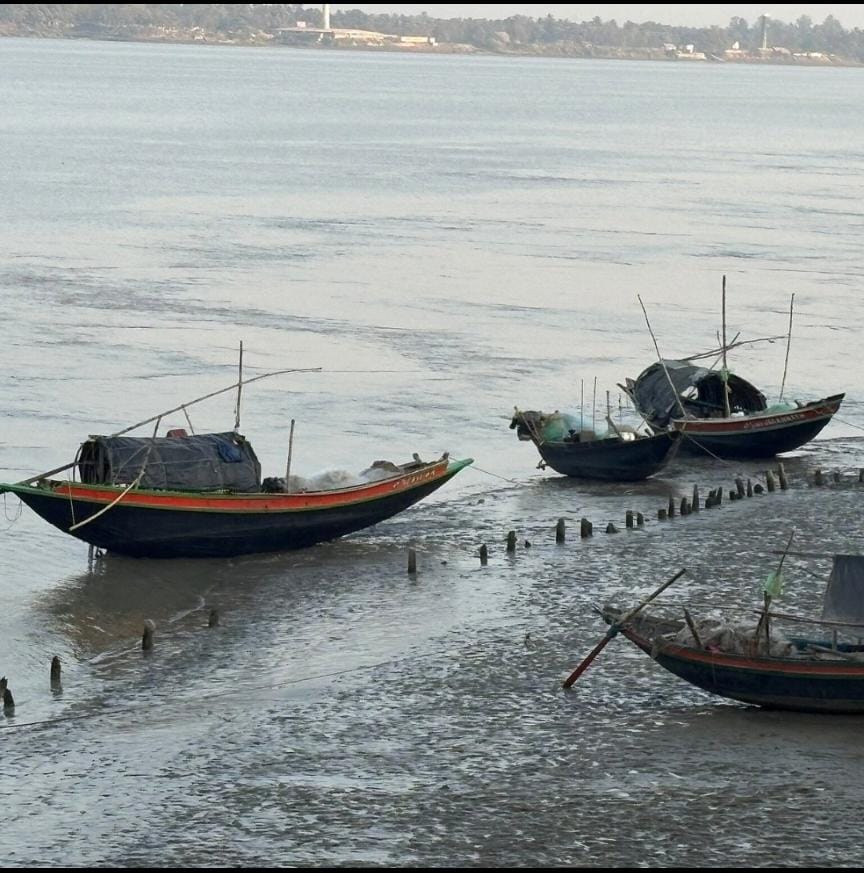 fishermen holding huge river fish