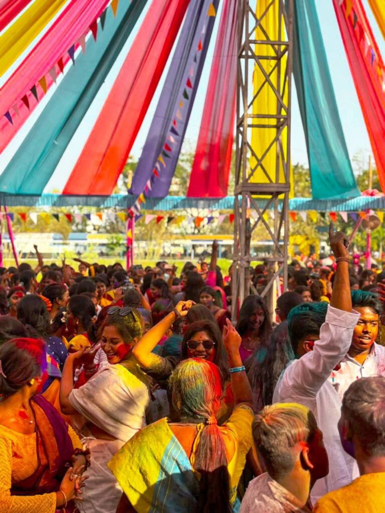 College students enjoying Holi festival in campus
